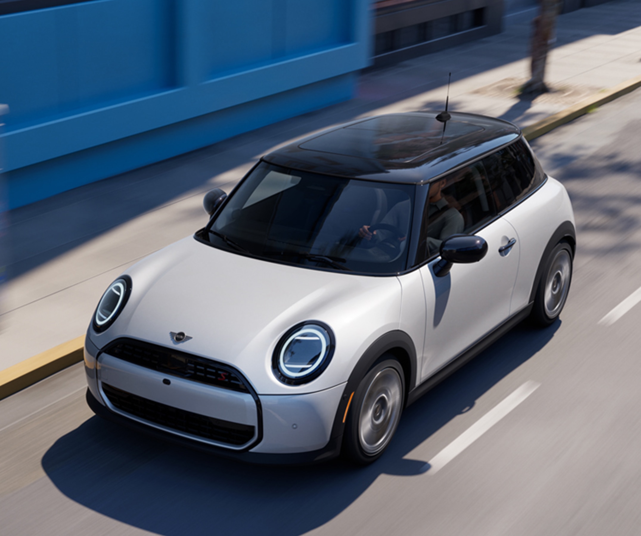 Bird's-eye view of a MINI Cooper S 2 Door driving down a street.