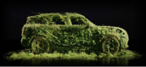 Side-view of the silhouette of a MINI made of green and purple plants.
